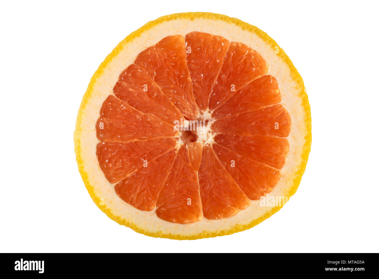 A photograph of a slice of grapefruit isolated on a white background. Stock Photo