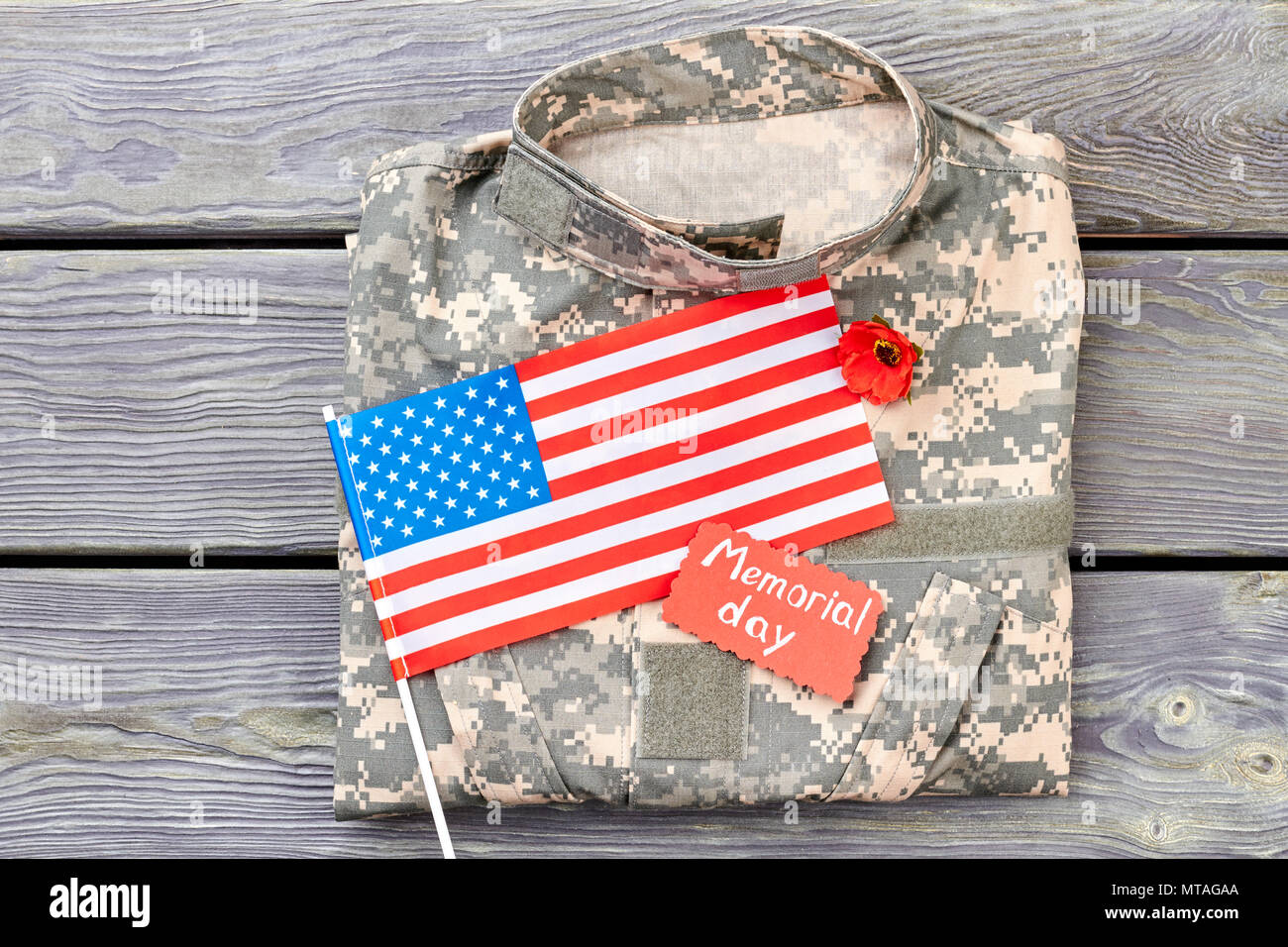 Camouflage jacket american flag and red poppy. Memorial day, patriotic accessories. Stock Photo