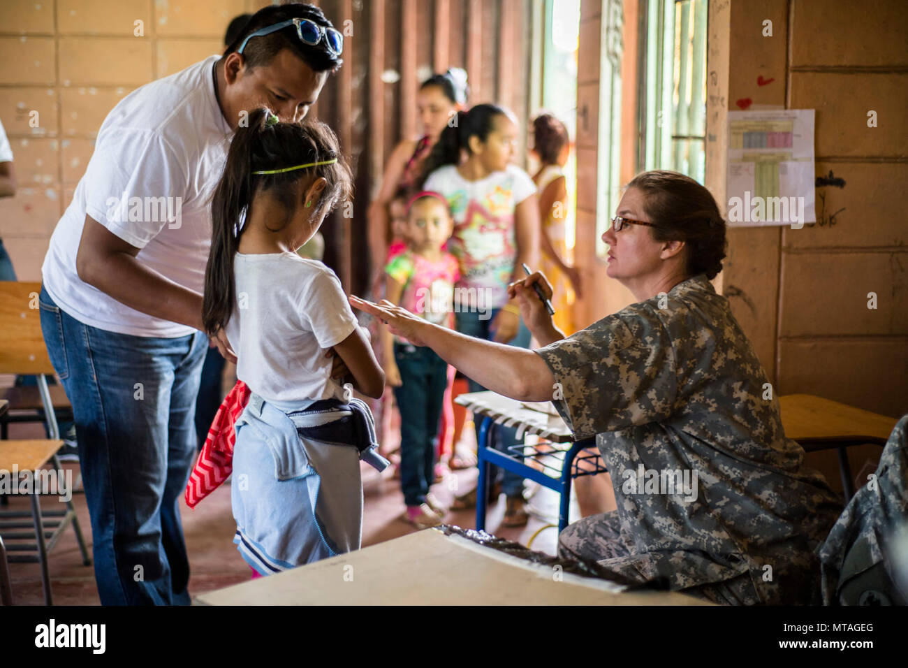 U.S. Army LTC. Rhonda Dyer provides deworming and preventive medication to Hondurans at a Medical Readiness Training Exercise site at Cooperativa village, Colon, Honduras , Apr. 20, 2017. Joint Task Force – Bravo Medical Element, provided care to more than 850 patients during a Medical Readiness Training Exercise in Cooperativa village, Colon, Honduras, Apr. 20-21, 2017. MEDEL also supported a Military Partnership Engagement and assisted more than 650 patients with the Hondurian Navy in Santa Rosa de Aguan, Colon, Honduras, Apr. 22, 2017. Stock Photo
