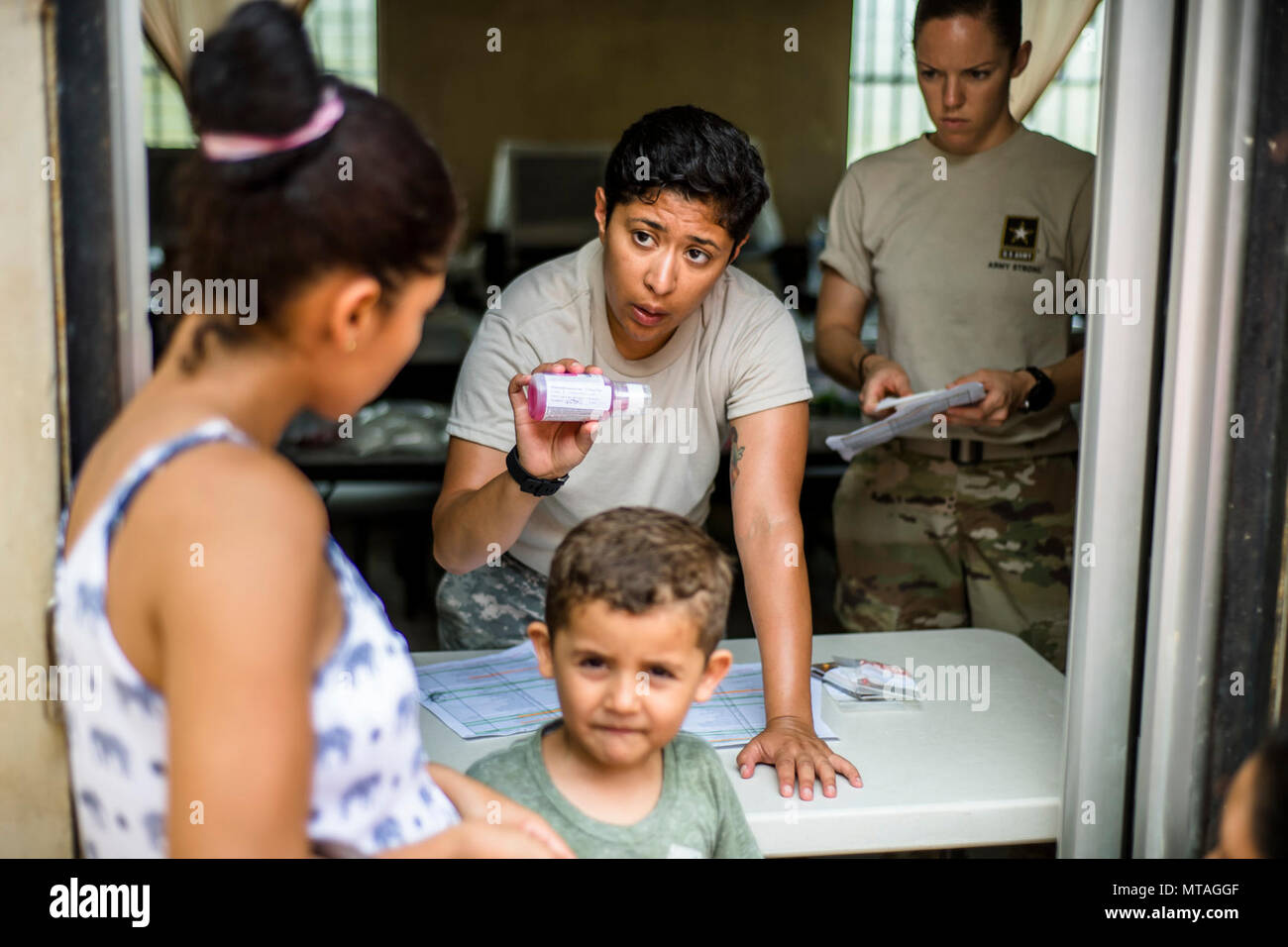 U.S. Army SGT. Carla Linares explains the medicine dosage to a Honduran patient at a Medical Readiness Training Exercise site at Cooperativa village, Colon, Honduras , Apr. 20, 2017. Joint Task Force – Bravo Medical Element, provided care to more than 850 patients during a Medical Readiness Training Exercise in Cooperativa village, Colon, Honduras, Apr. 20-21, 2017. MEDEL also supported a Military Partnership Engagement and assisted more than 650 patients with the Hondurian Navy in Santa Rosa de Aguan, Colon, Honduras, Apr. 22, 2017. Stock Photo