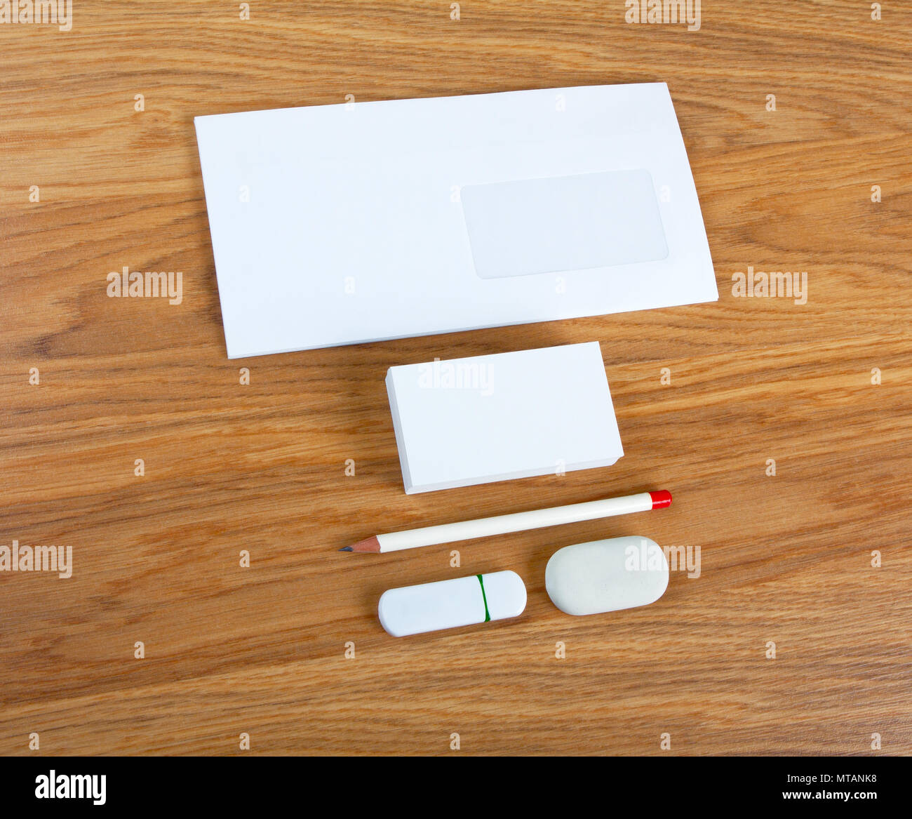The White Elements Of Corporate Identity On A Wooden Background
