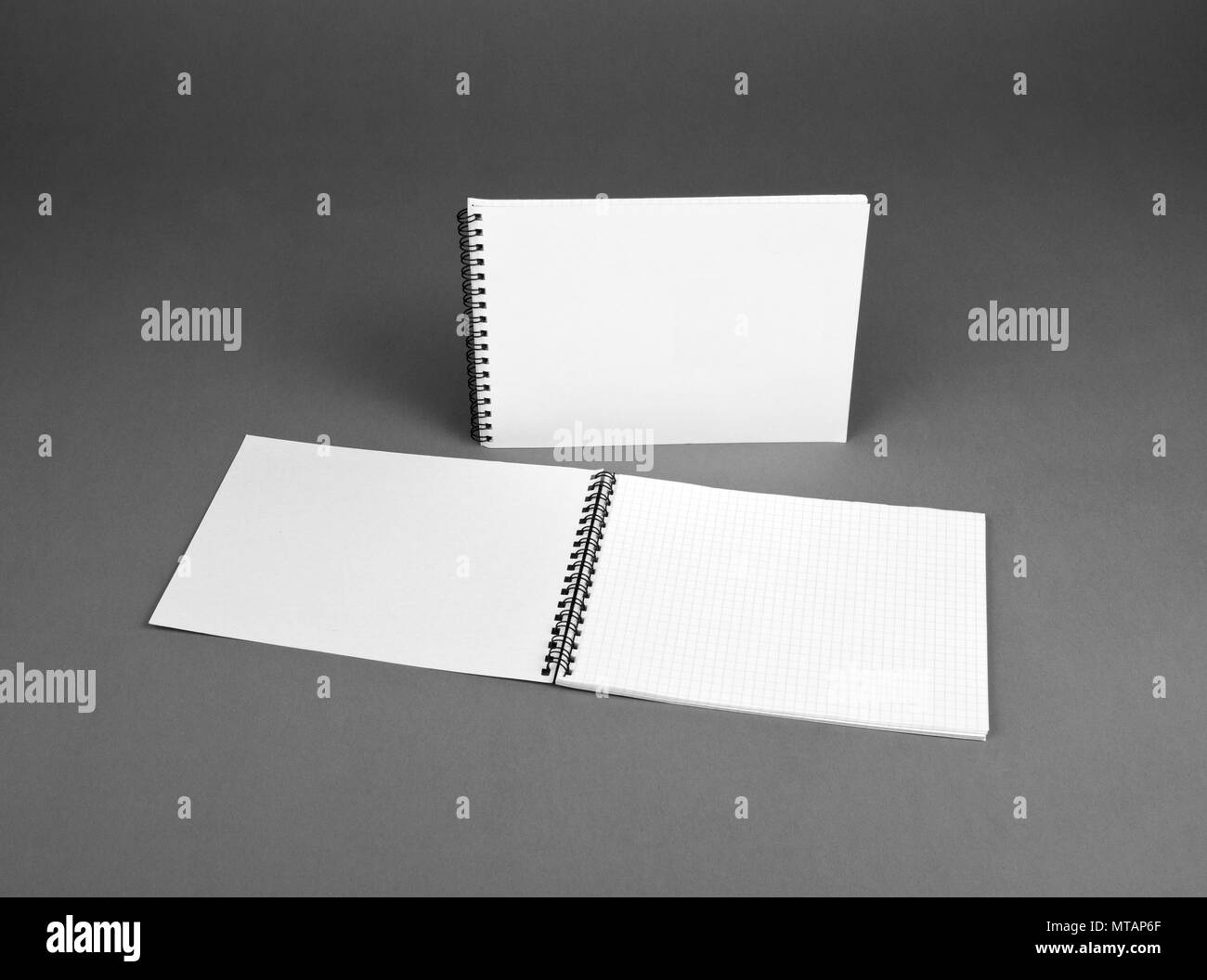 Blank spiral notebook on gray background. Template for your design Stock Photo