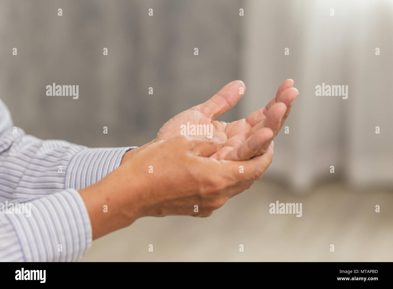 Elder Office Male Hand Palm massage at home Stock Photo