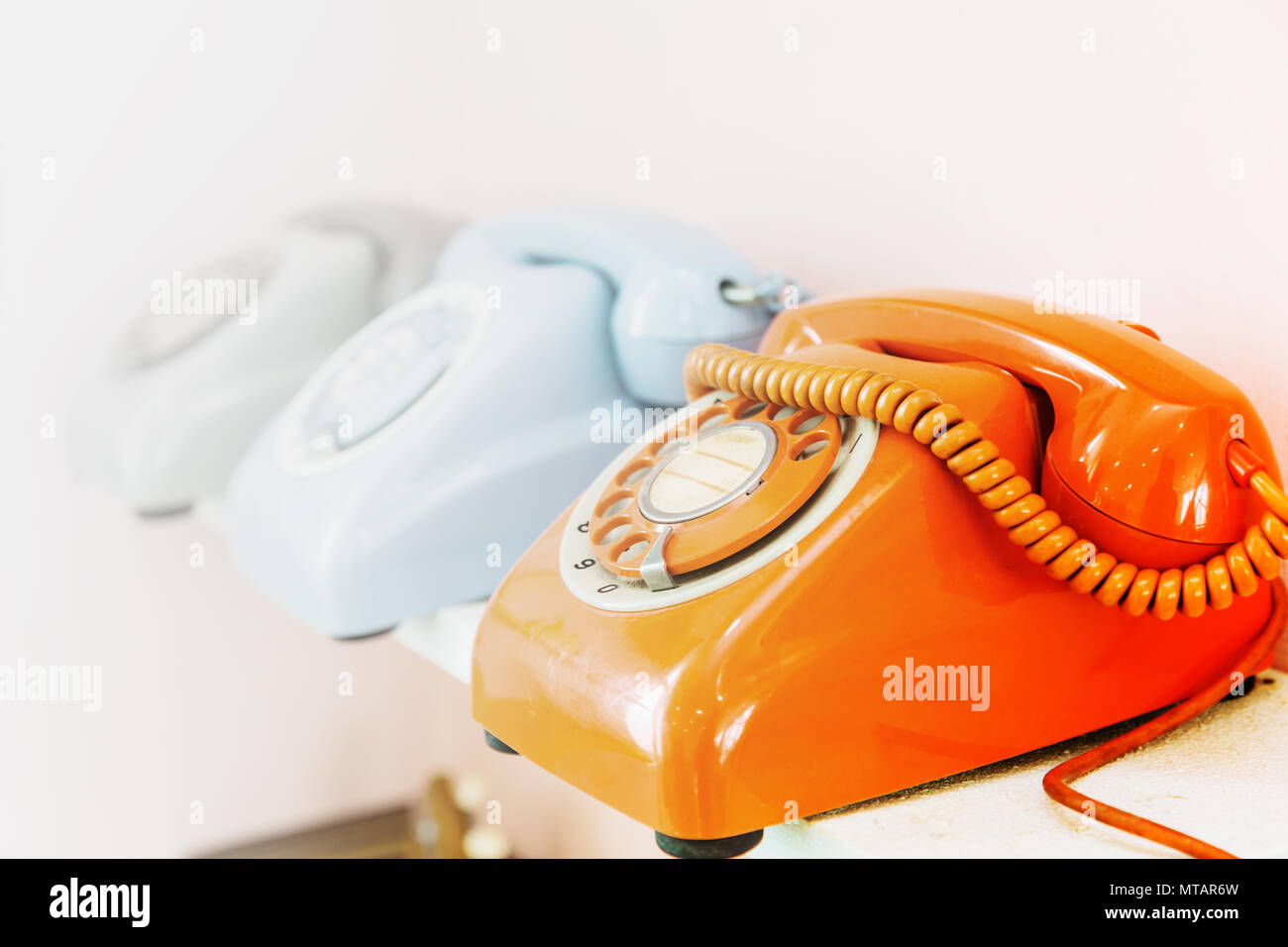 dial phone row with space for calling contact us background Stock Photo