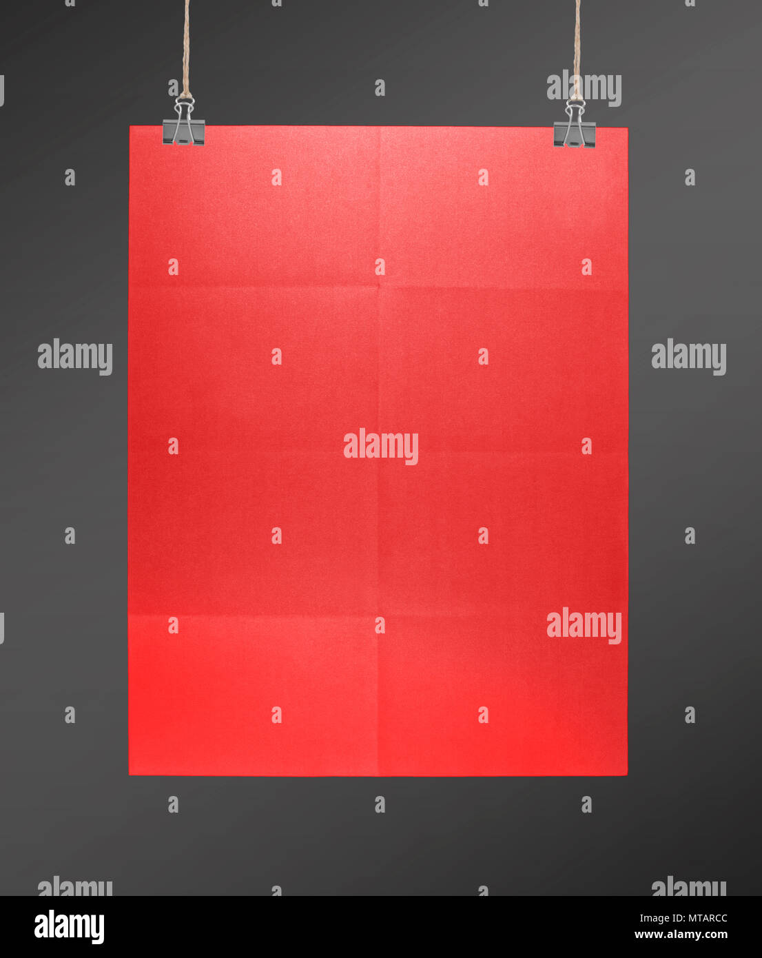 Red poster on a rope Stock Photo