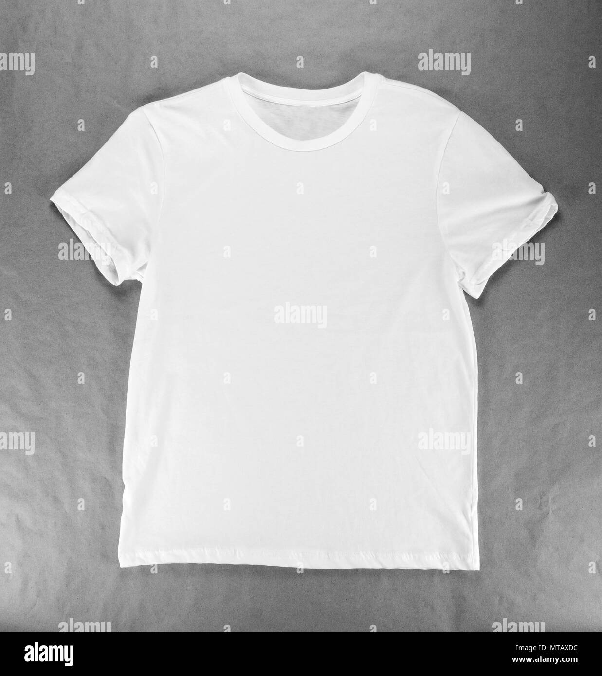 White folded t-shirt template on a craft paper Stock Photo