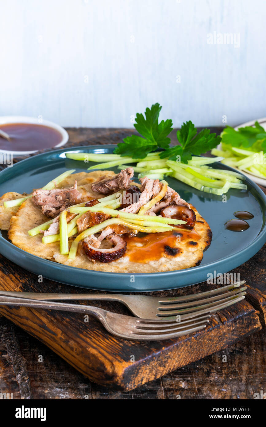 Crispy duck with pancakes, plum sauce, shredded cucumber and spring