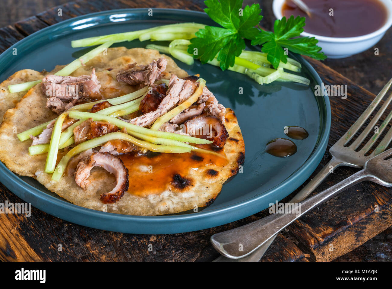 Crispy duck with pancakes, plum sauce, shredded cucumber and spring