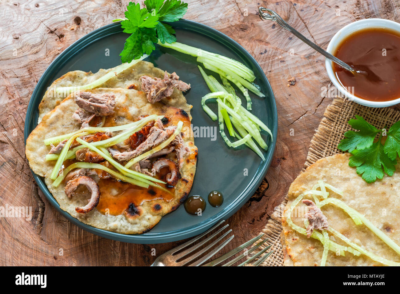 Crispy duck with pancakes, plum sauce, shredded cucumber and spring