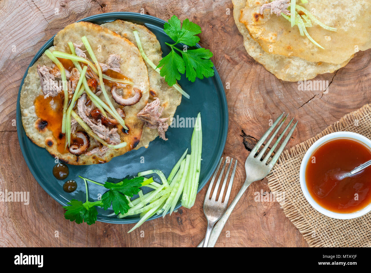 Crispy duck with pancakes, plum sauce, shredded cucumber and spring