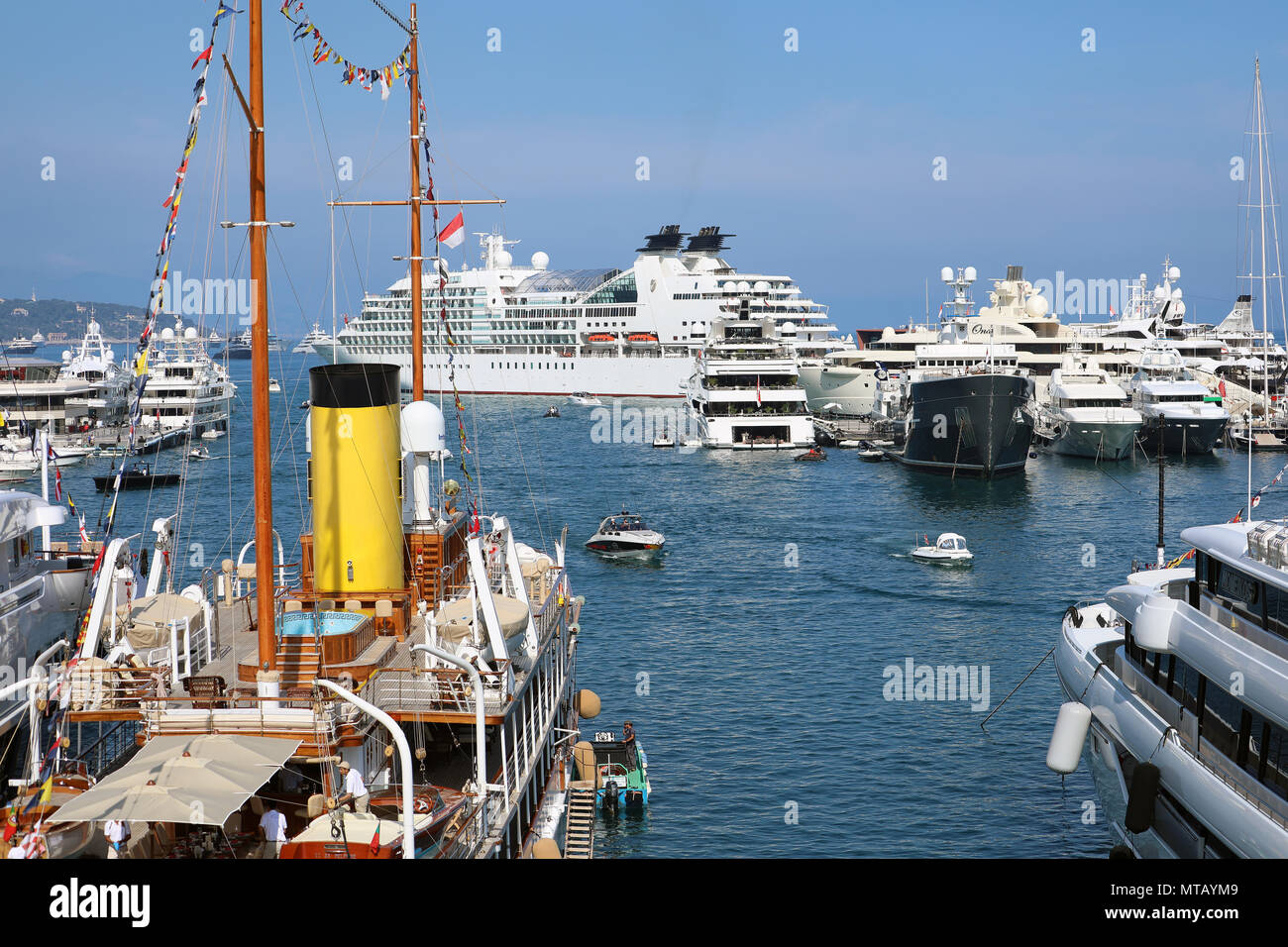 Monte-Carlo; Monaco - May 24; 2018: Rear View of a Vintage Luxury Sailboat In The Monte-Carlo Harbour (Port Hercule), Cruise Liner in The Background.  Stock Photo