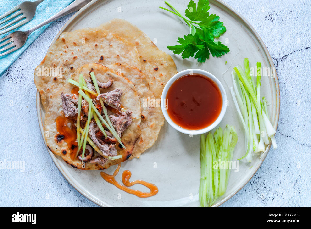 Crispy duck with pancakes, plum sauce, shredded cucumber and spring