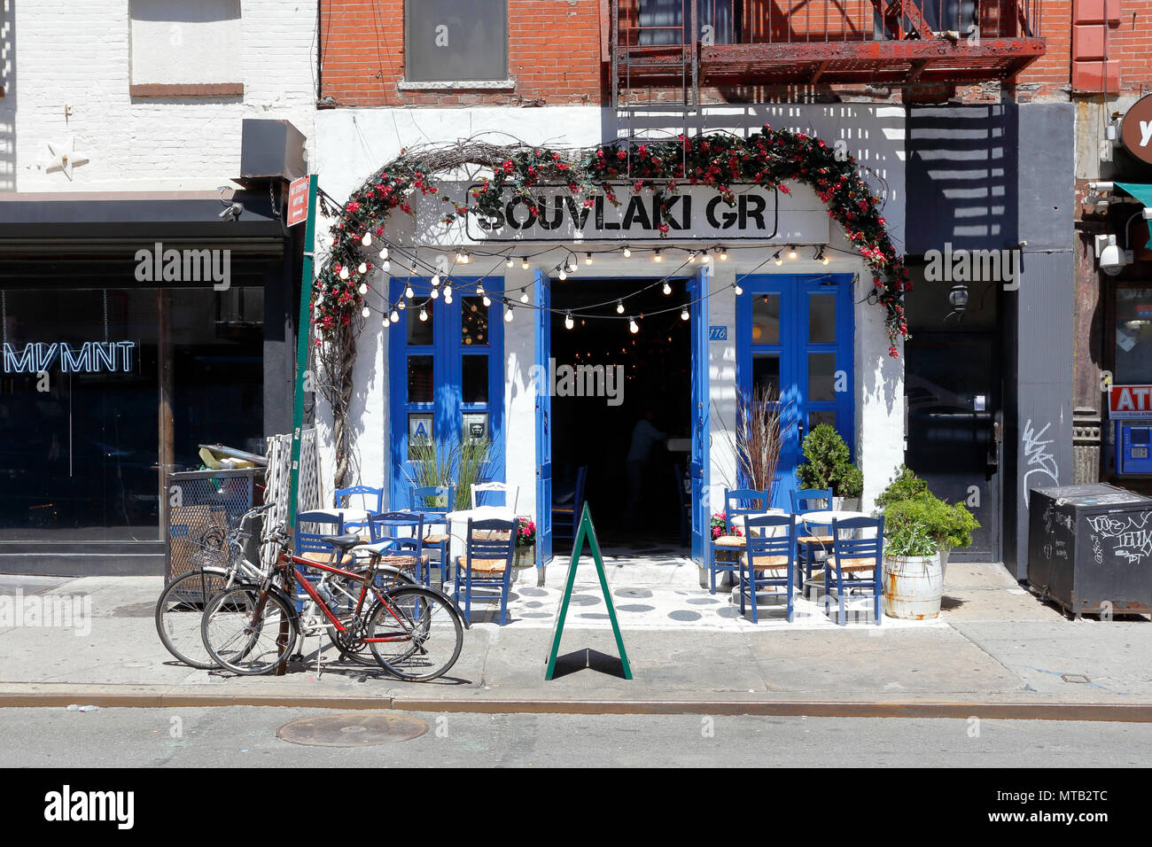 Souvlaki GR, 116 Stanton St, New York, NY. exterior storefront of a greek restaurant, and sidewalk cafe in Manhattan's Lower East Side. Stock Photo