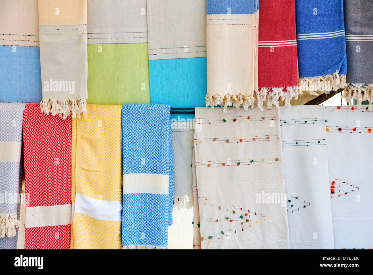 Pastel colorful loincloth and tablecloth hanging in an authentic Turkish bazaar Stock Photo
