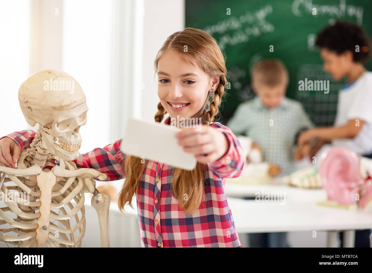 Cheerful positive girl smiling into the camera Stock Photo