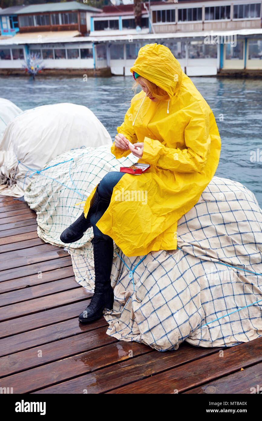 Woman wearing raincoat hi-res stock photography and images - Page 2 - Alamy
