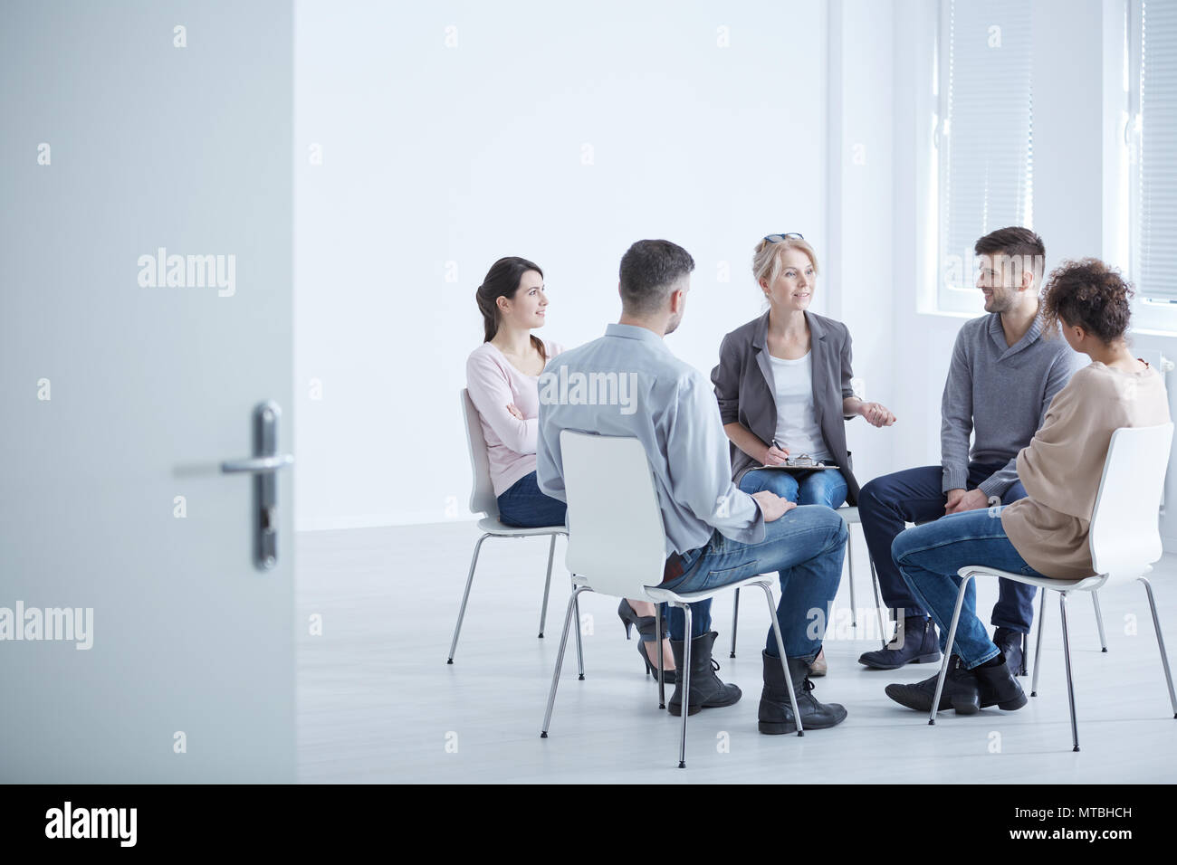 People participating in group therapy for social skills training Stock ...