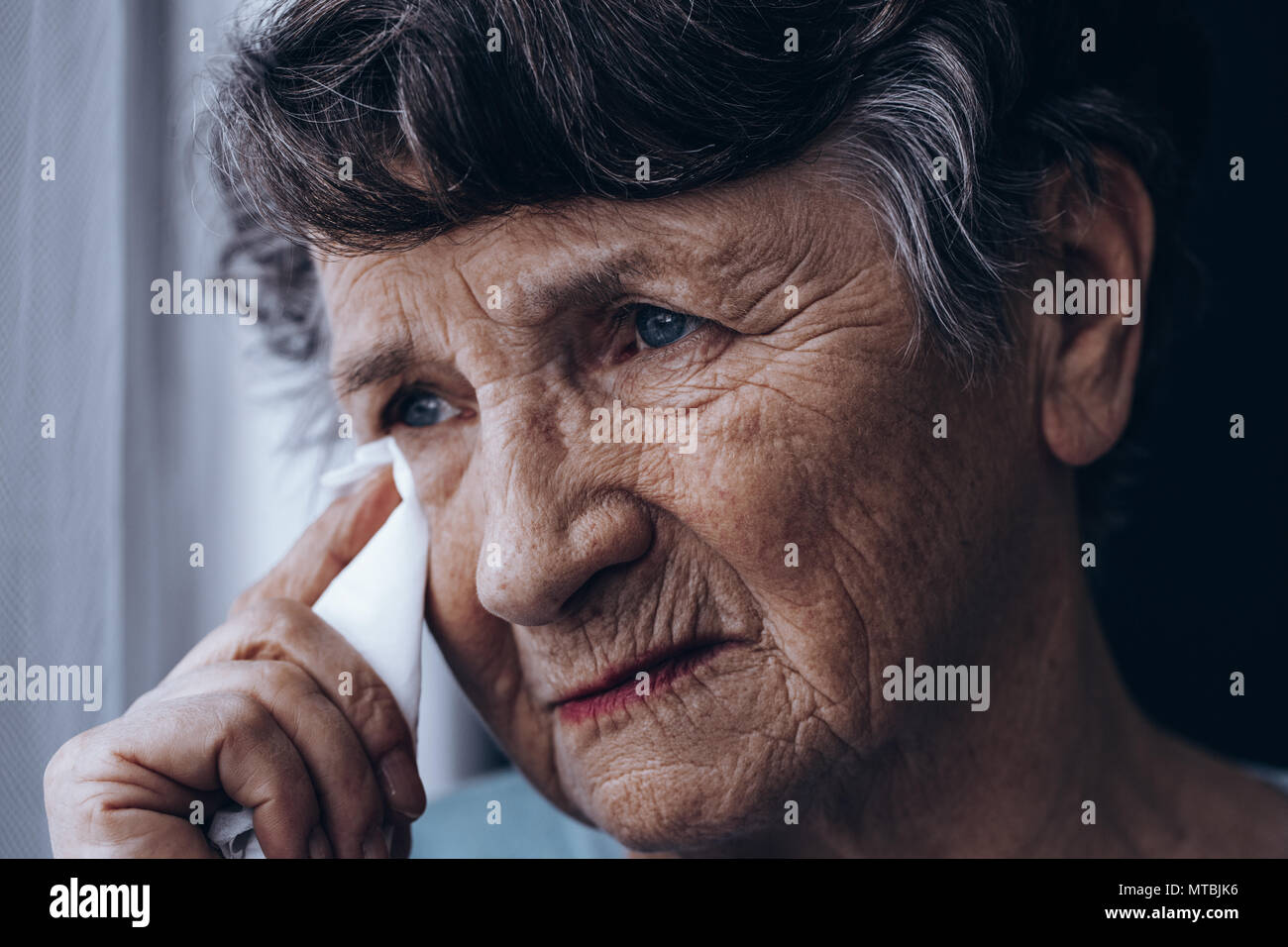 Portrait Of Crying Senior Woman, Holding Tissue Stock Photo - Alamy