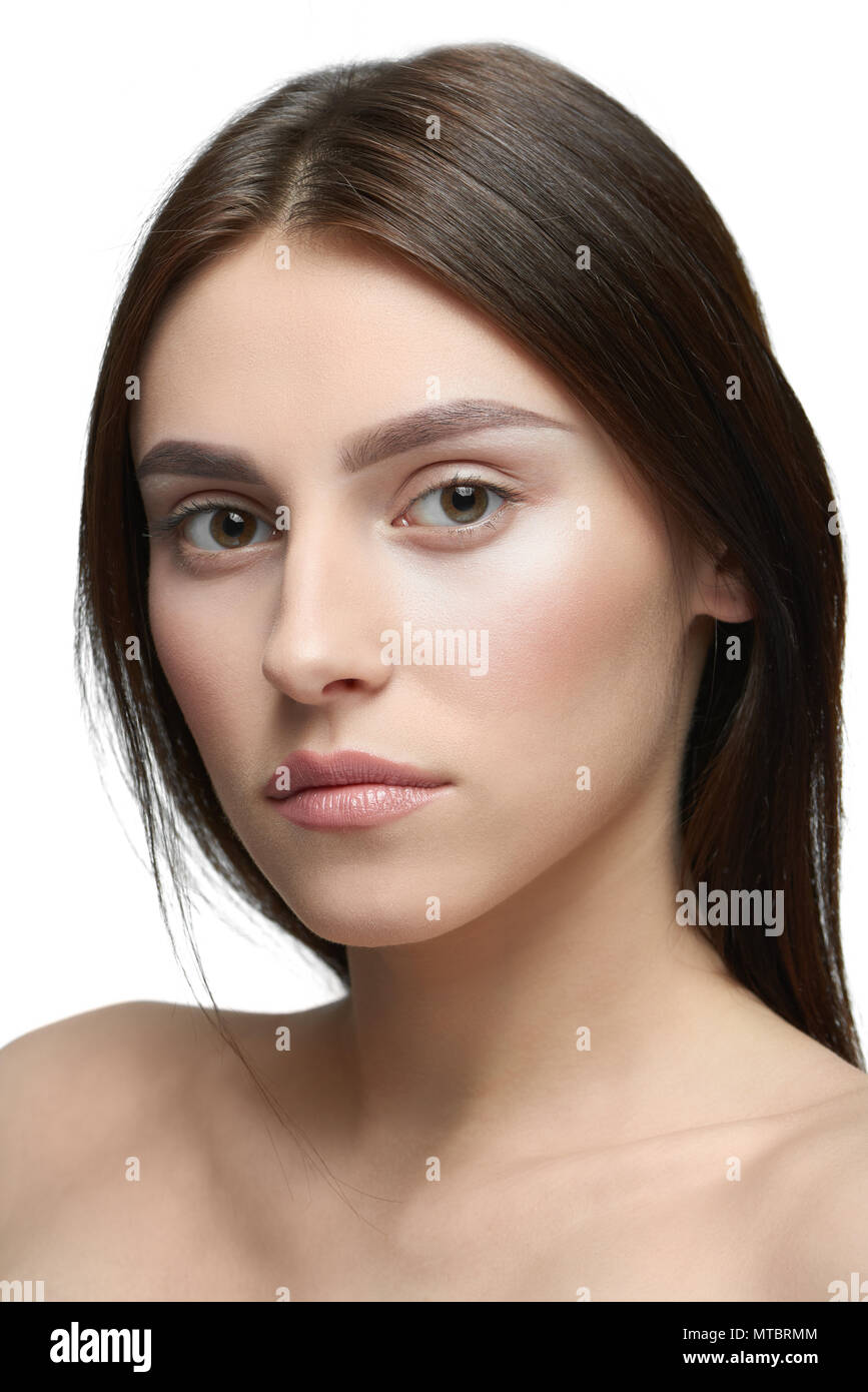 Close Up Of A Girl With Light Day Make Up Looking At Camera