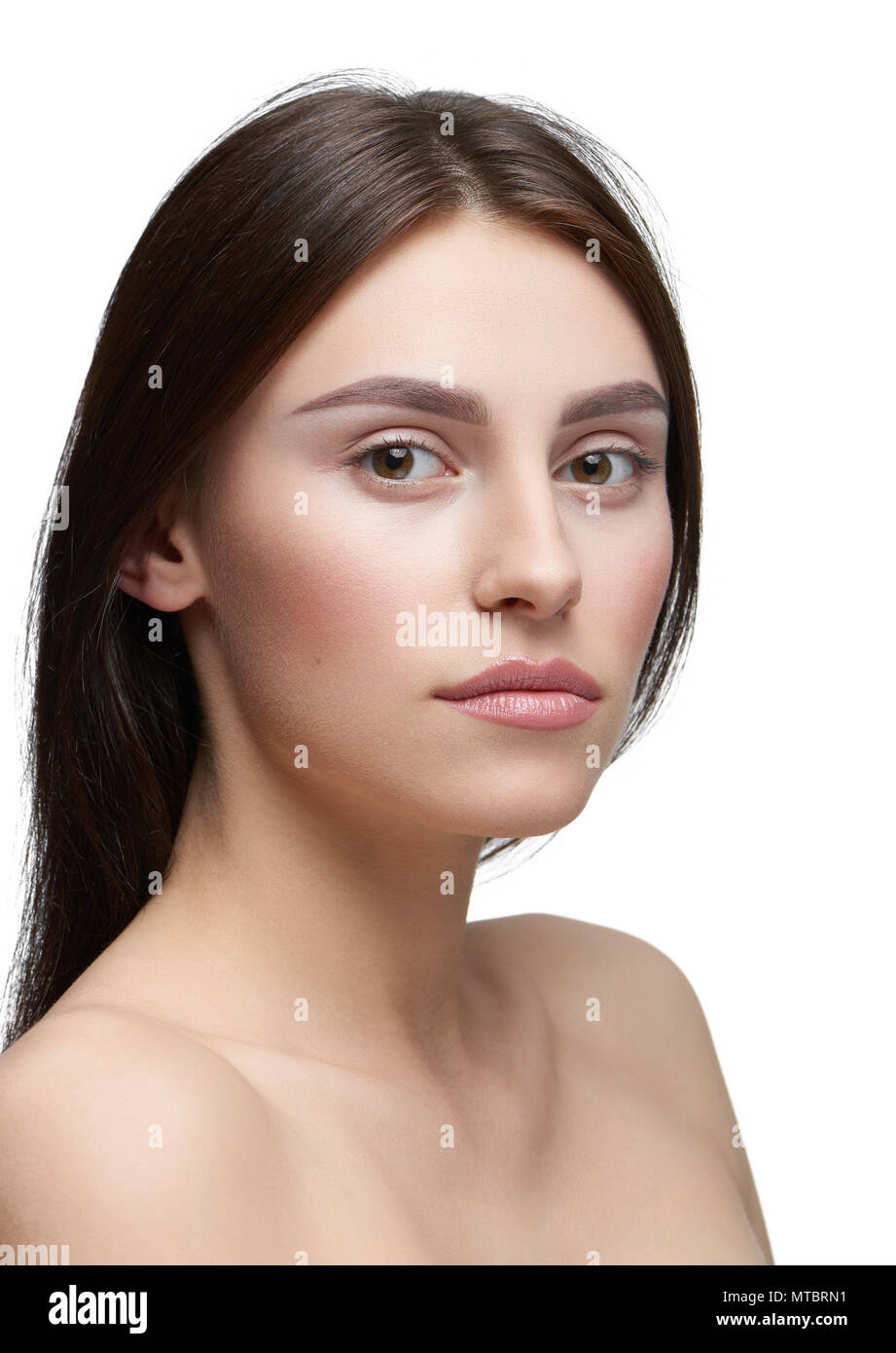 Sideview Of A Girl With Light Day Make Up Looking At Camera