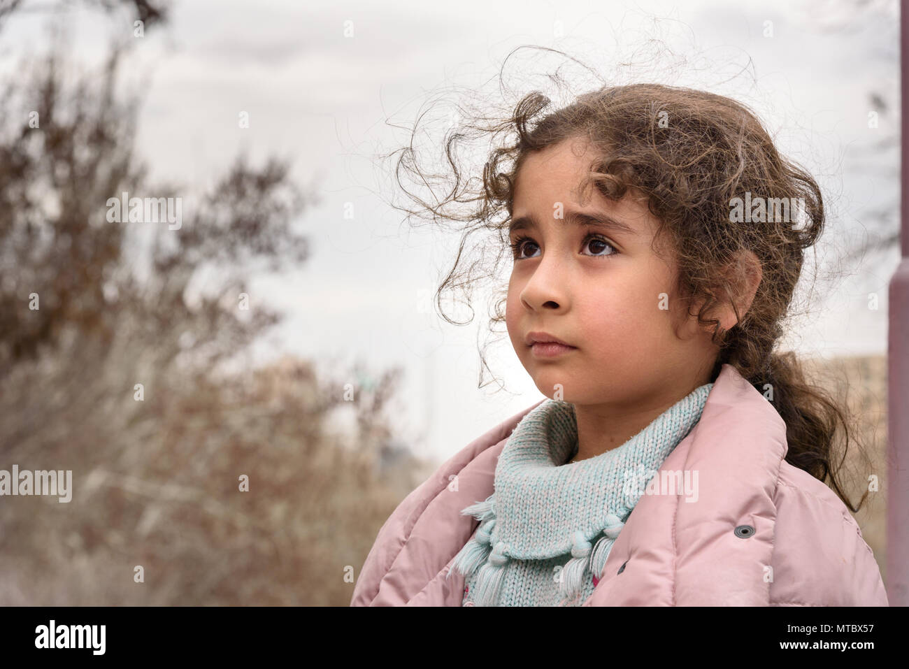 Tabriz, East Azerbaijan province, Iran - March 15, 2018: Iranian girl on the city street in park in spring Stock Photo