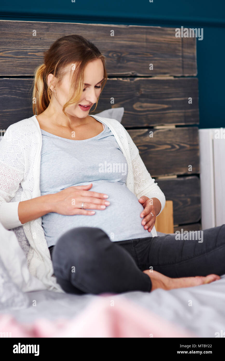Hands of young pregnant woman put headphones with classical music on her pregnant  belly. Concept of intellectual intrauterine development of the child Stock  Photo - Alamy