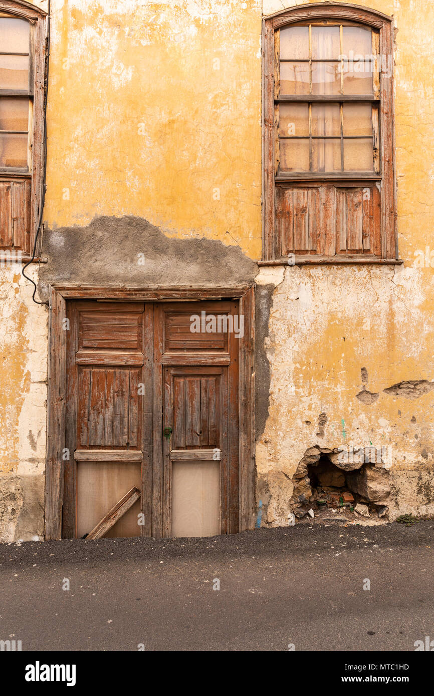 Abstract details of old wooden doors and windows, neglected with peeling paintwork and broken glass, Vilaflor, Canary Islands, Spain, Stock Photo