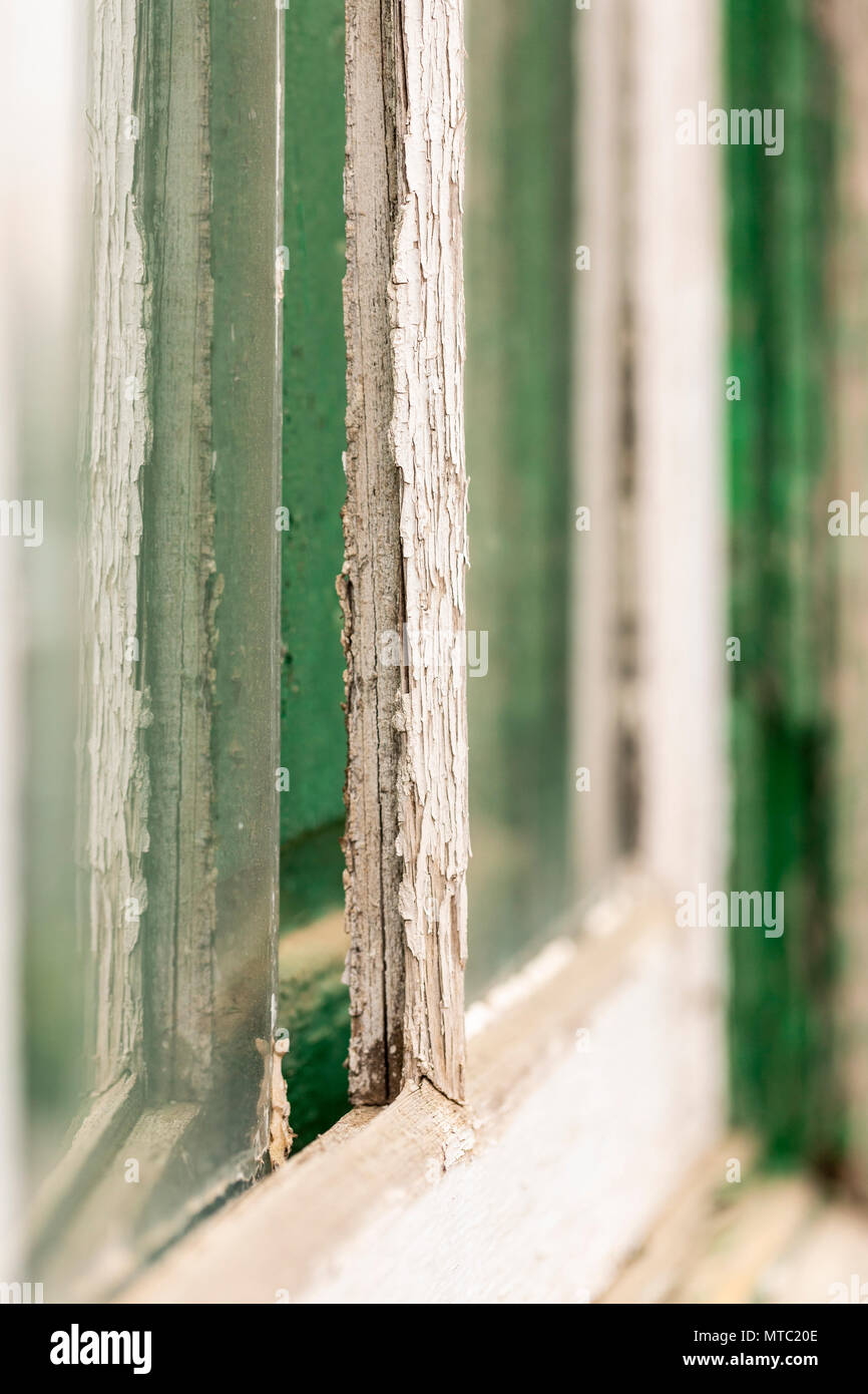 Abstract details of old wooden windows, neglected with peeling paintwork and broken glass, Vilaflor, Canary Islands, Spain, Stock Photo