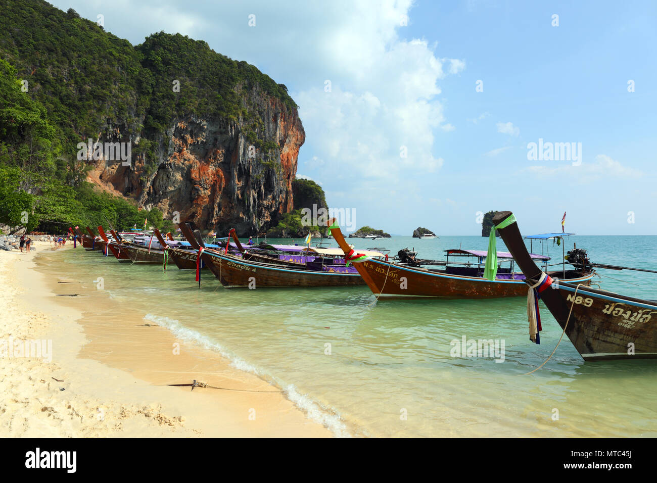 Long tail boats on tropical beach in Thailand Stock Photo