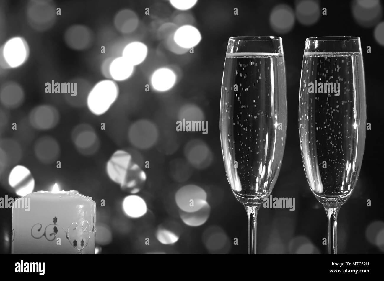 glasses with champagne and candle Stock Photo