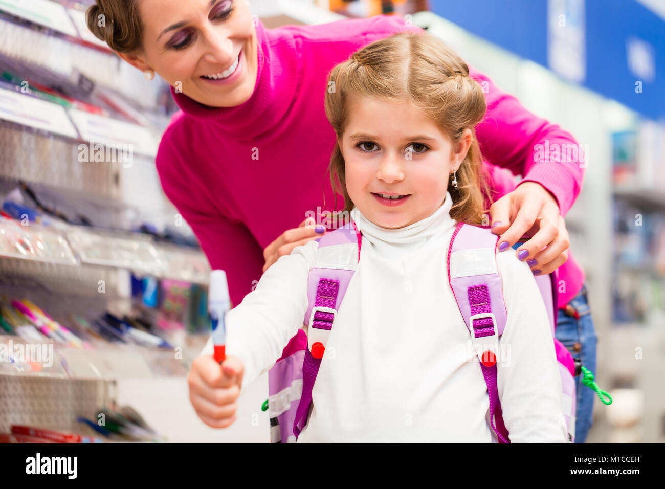 Family buying school supplies in stationery store Stock Photo