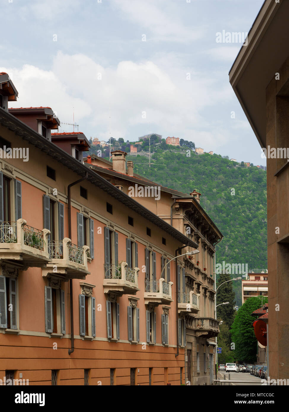 the small town of Brunate seen from the historic center of Como, Italy Stock Photo