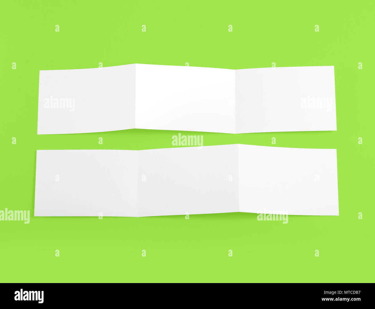 Blank folding page booklet on green background Stock Photo