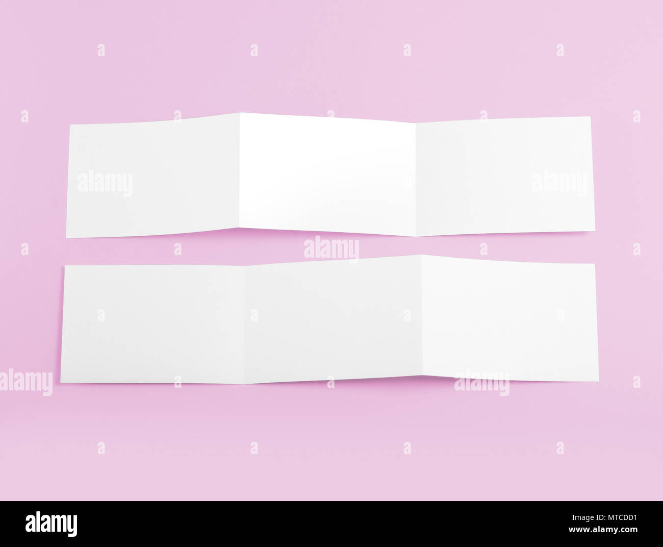 Blank folding page booklet on pink background Stock Photo