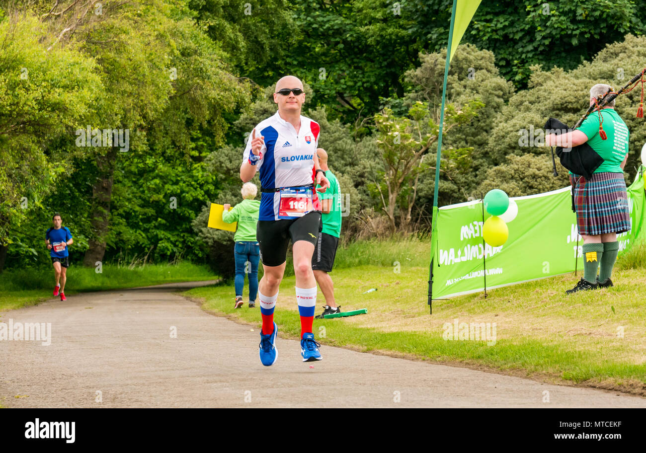 Runner with both feet off ground hires stock photography and images