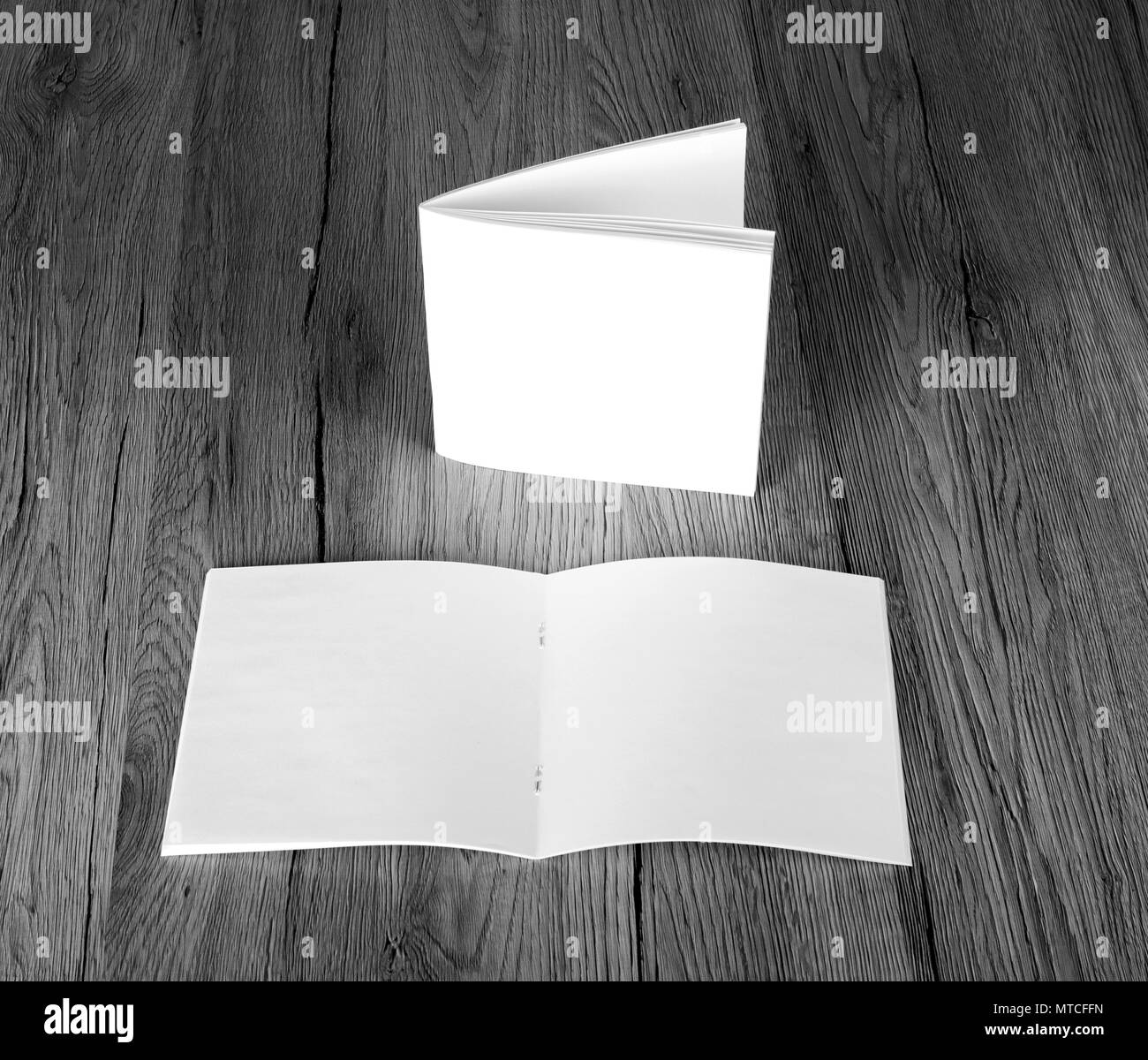 Blank catalog, brochure, magazines, book on wooden background, top view