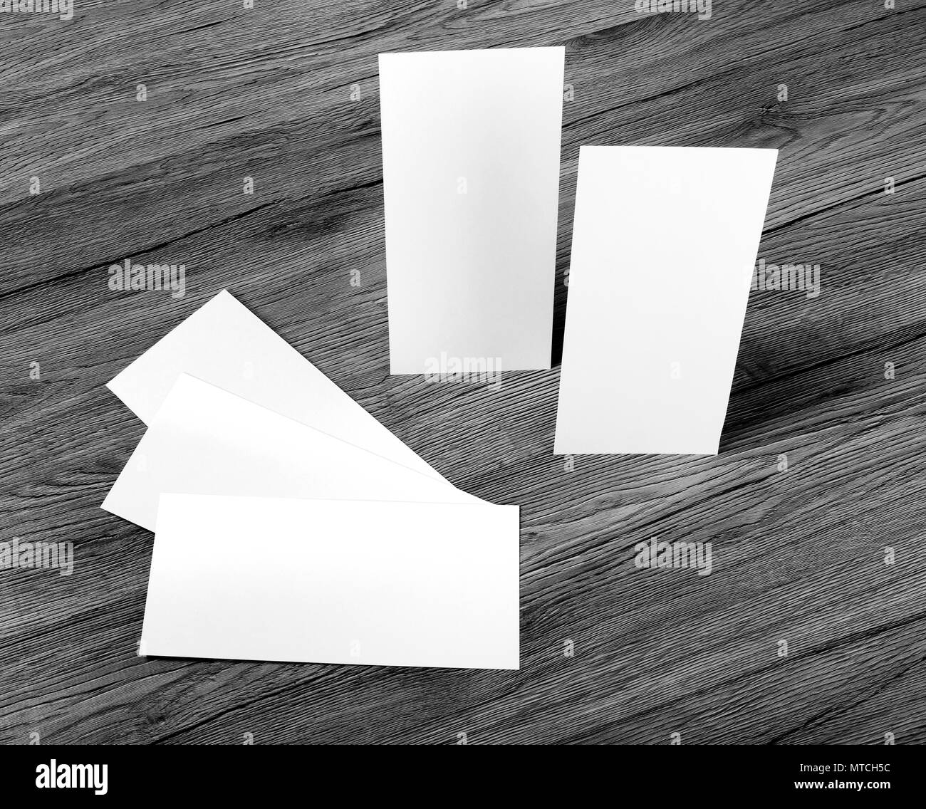 Blank flyer over wooden background to replace your design Stock Photo