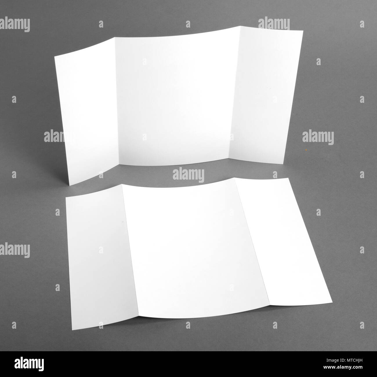 Blank gate fold brochure on grey to replace your design Stock Photo Alamy