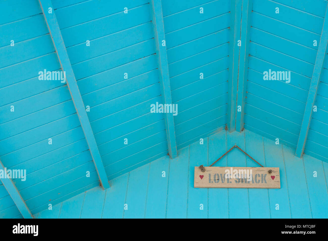 Love Shack Written In Hand Painted Words On A Wooden Panel Board