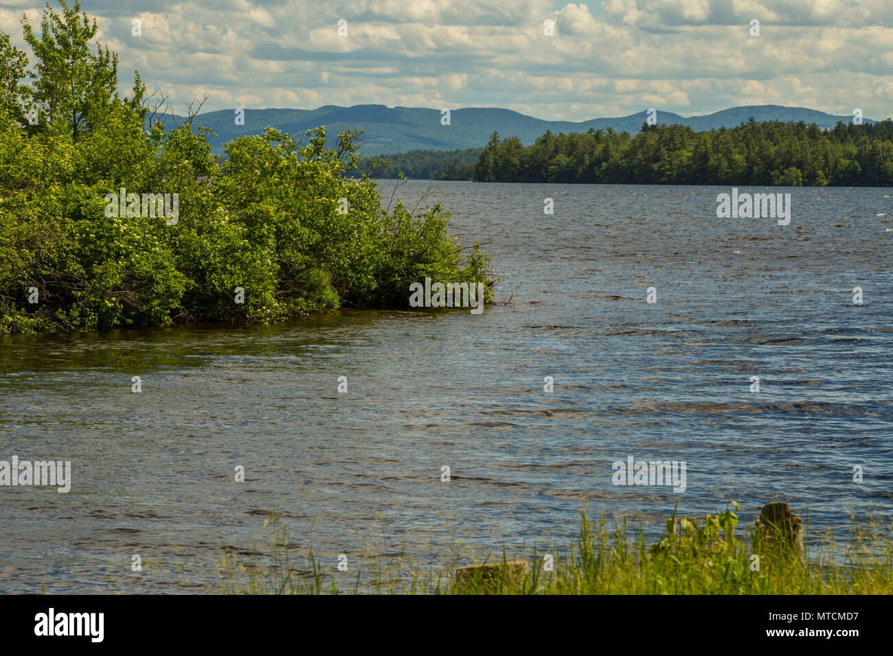 Cove with blue water mountains in background Wolfeboro, New Hampshire