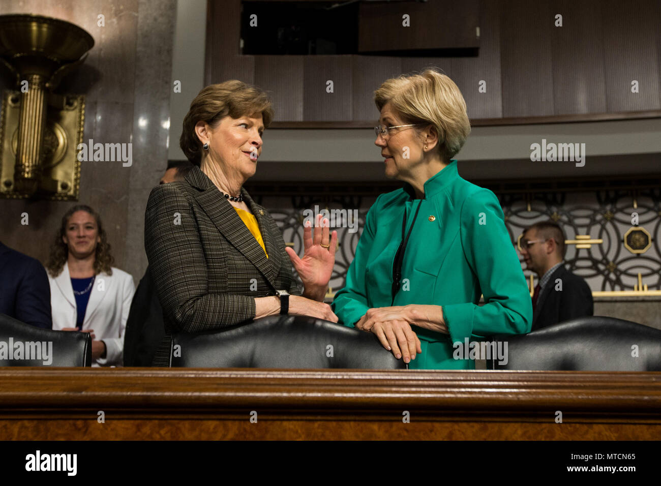 Senators Jeanne Shaheen (D-NH)(left) and Elizabeth Warren (D-MA) converse prior to a Senate Armed Services Committee meeting at the U.S. Capitol on May 18th, 2017. Stock Photo