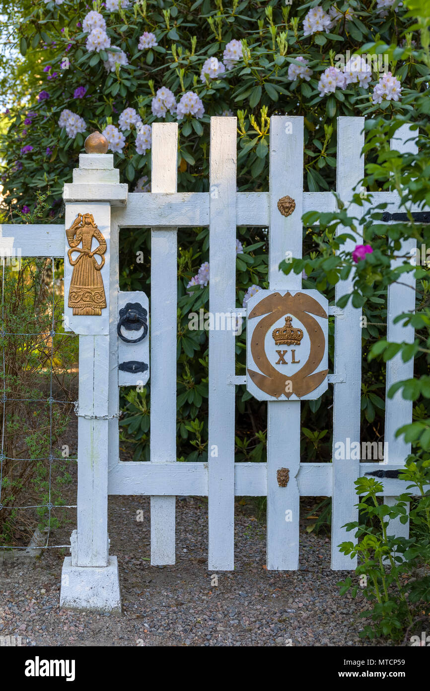 Ornate gilded gold and white wood fence gate door Stock Photo