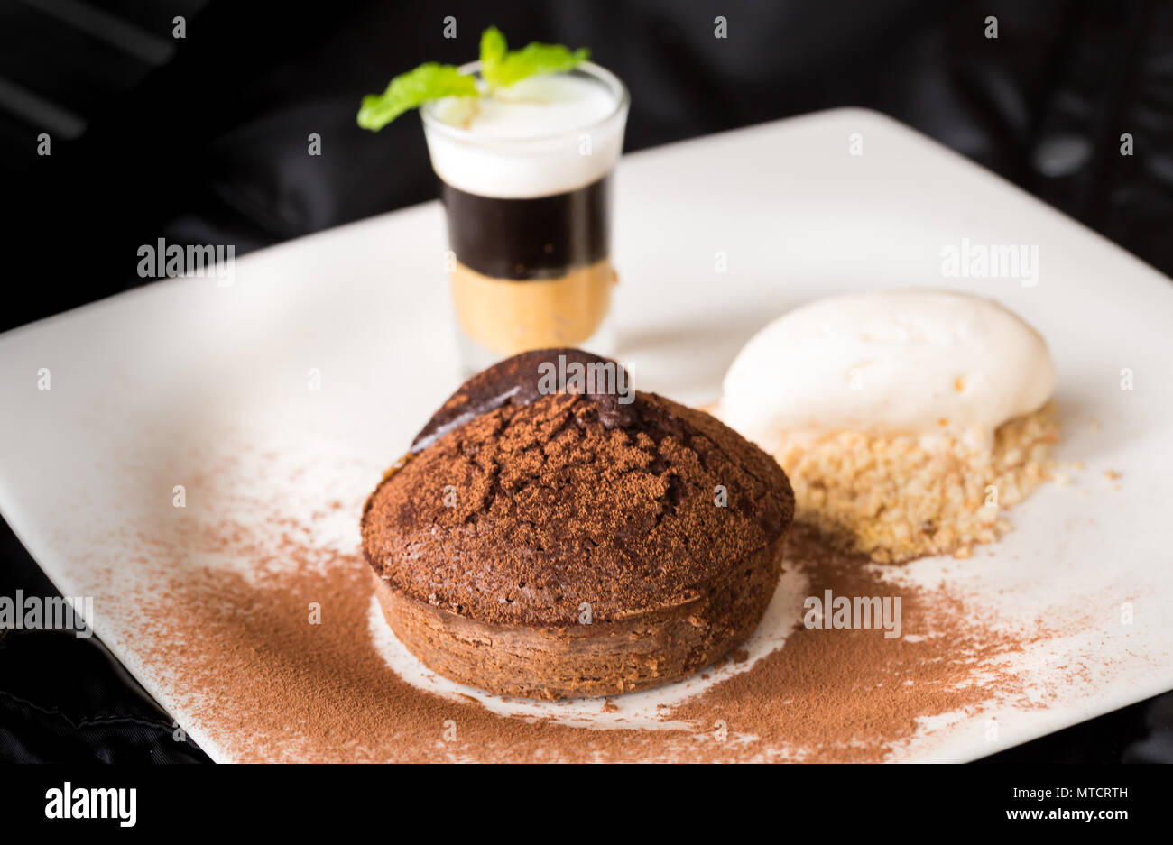 Molten chocolate cake with peanut butter shooter Stock Photo Alamy