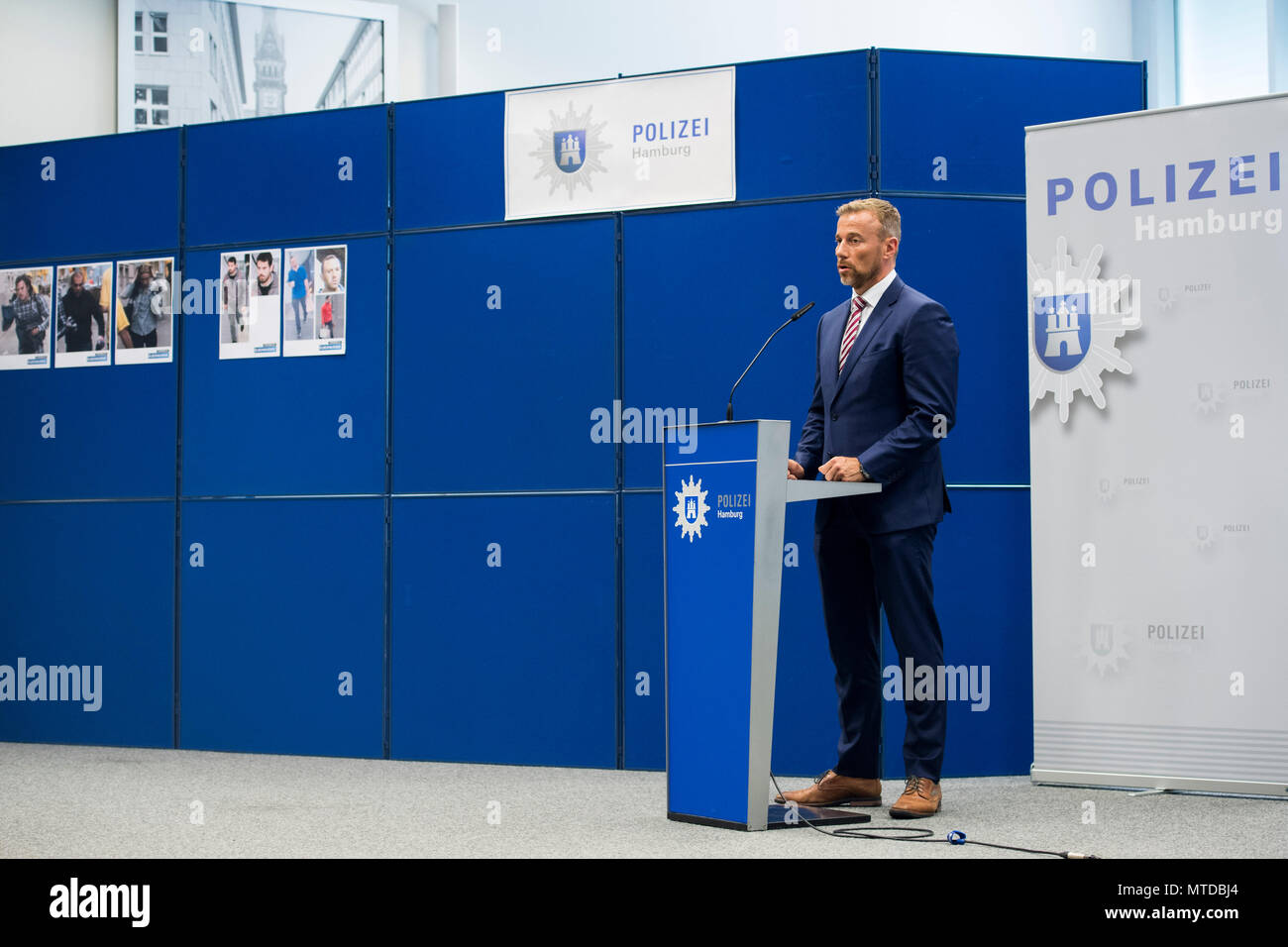 29 May 2018, Germany, Hamburg: Jan Hieber, head of the special commission 'Schwarzer Block' (lit. black block), delivers a statement during a press conference in Hamburg. This morning, the police conducted raids in Italy, France, Switzerland and Italy that are associated with crimes, which had been committed during the G20 Summit in Hamburg. Photo: Malte Christians/dpa Stock Photo