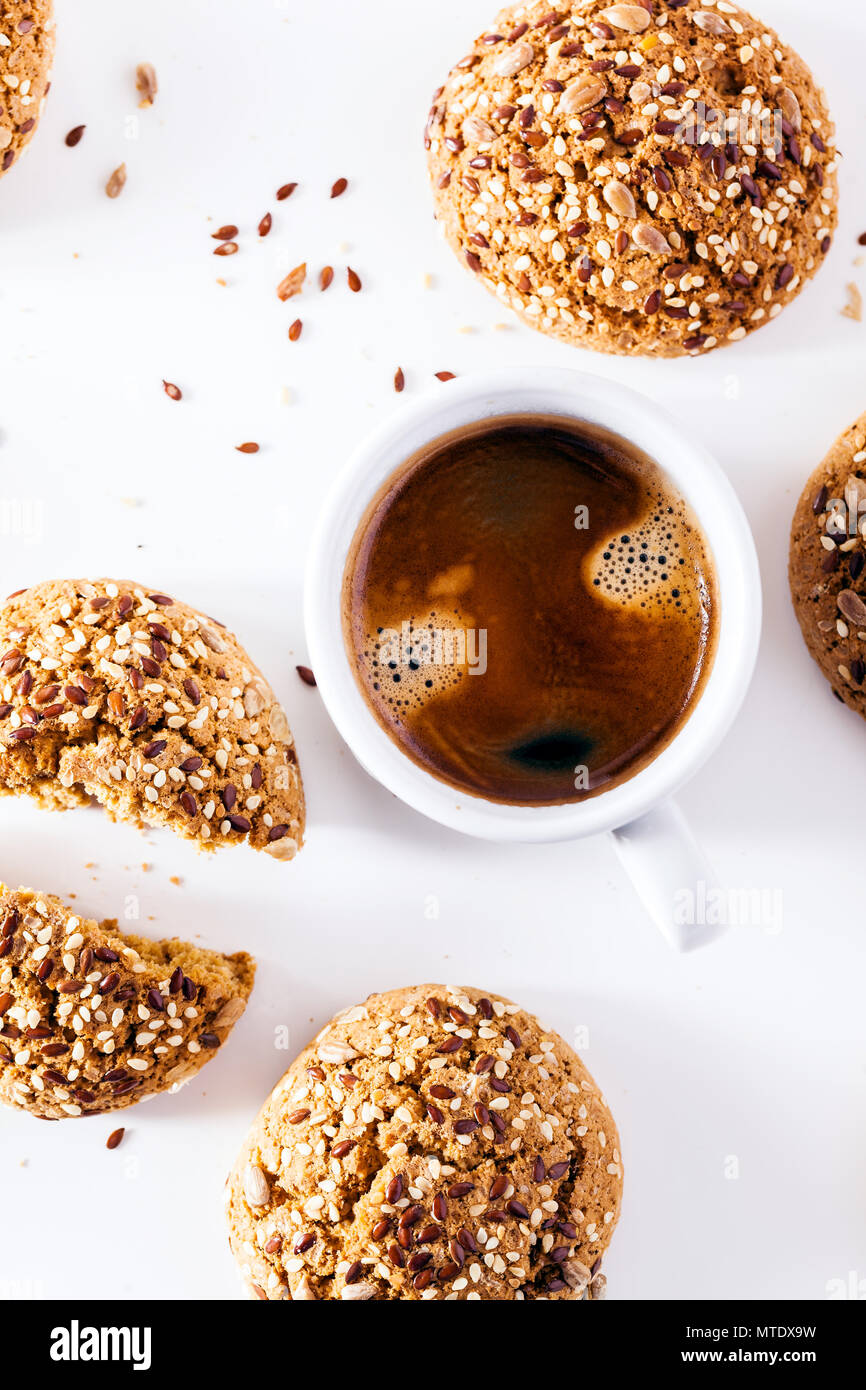 a cup of espresso and fresh biscuits on a white background. a frame for