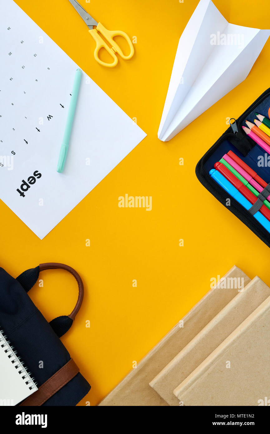Office Supplies on Yellow Background Stock Photo