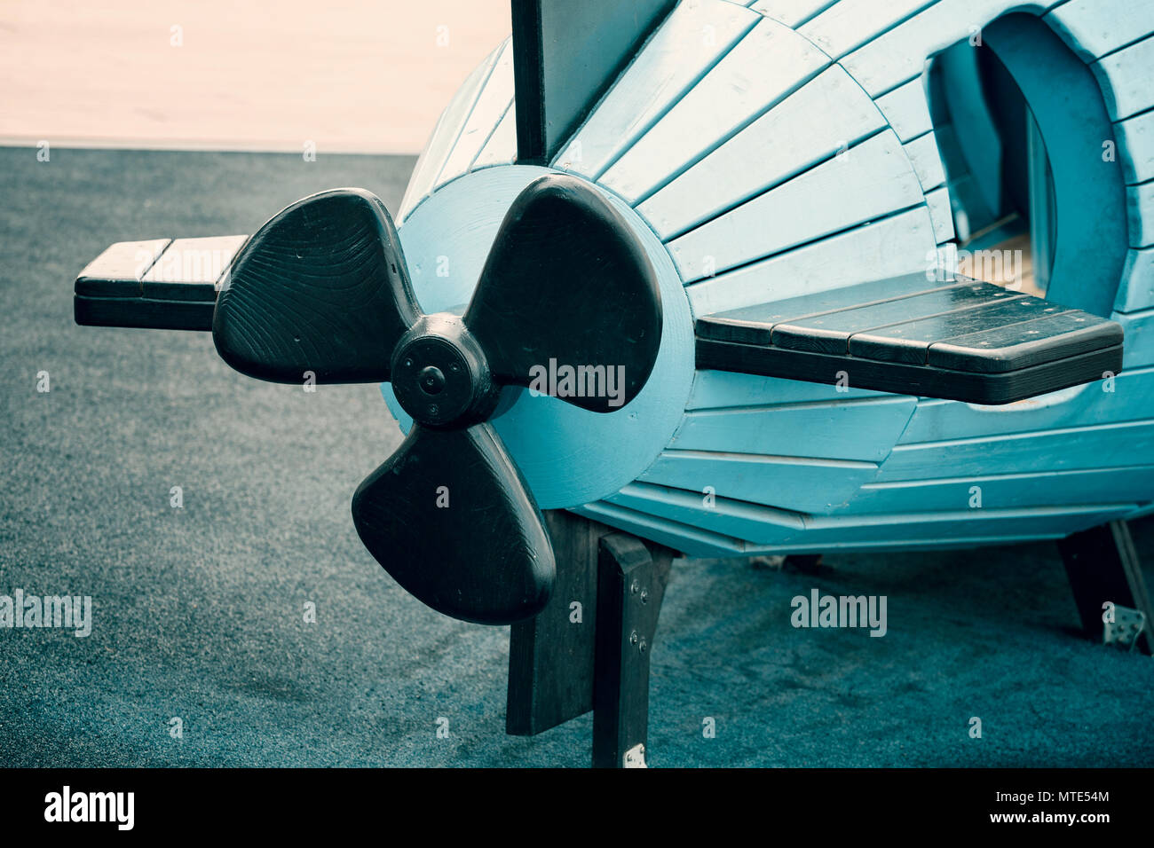 Black propeller on blue plastic toy submarine, children toy in the park Stock Photo Alamy