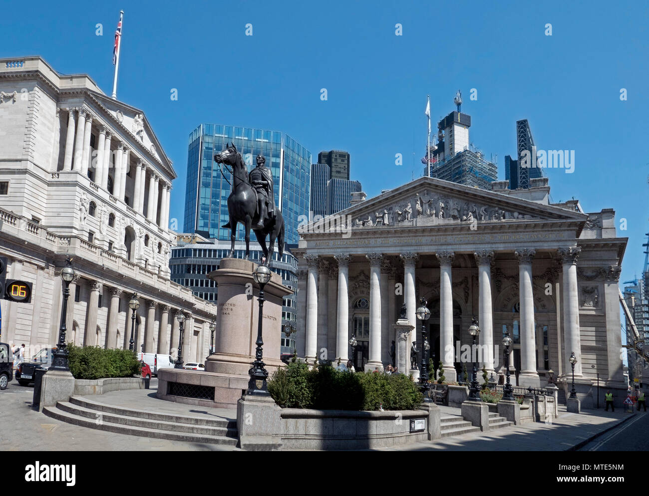 View from Bank Junction of Bank of England, Duke of Wellington Statue & Royal Exchange under clear blue summer sky Stock Photo