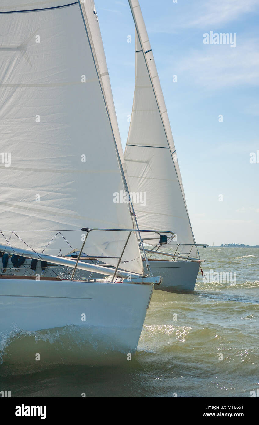 Two sailing boats, sailboat or yachts at sea Stock Photo