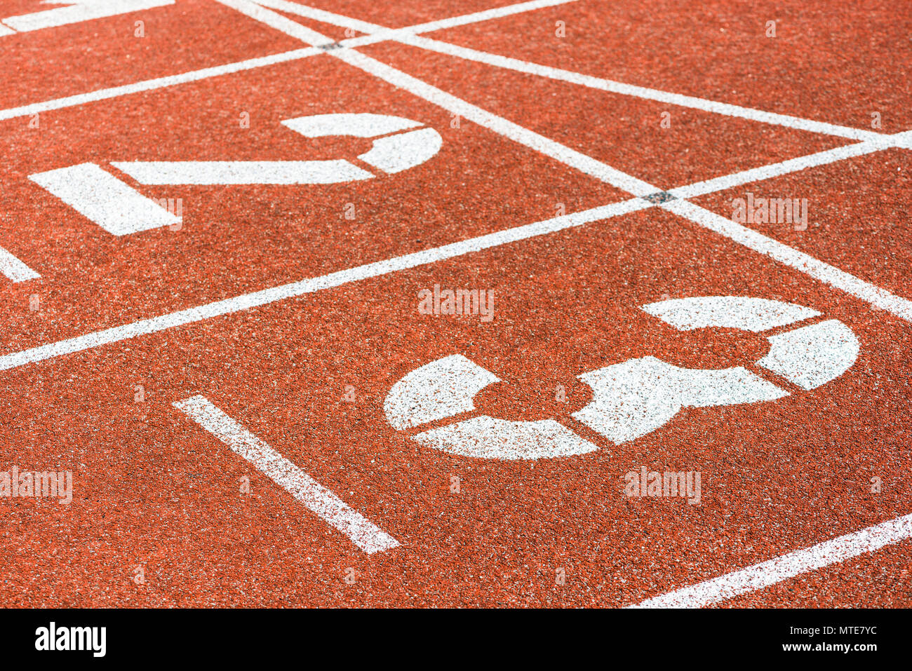 Starting numbers of running track in sports stadium Stock Photo